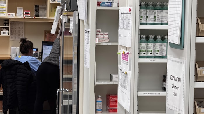 Two people work in the pharmacy of a hospital. access always difficult meetings orphaned access always difficult meetings orphaned new