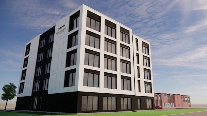 Un bâtiment moderne est dessiné à côté du bâtiment principal de l'Hôtel Rimouski.
