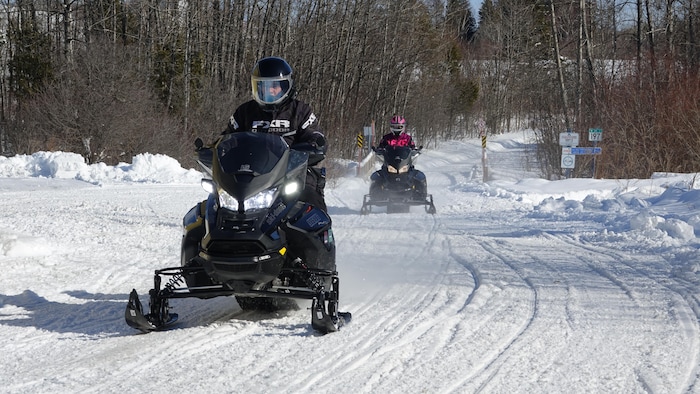 Two marked snowmobile pathways.
