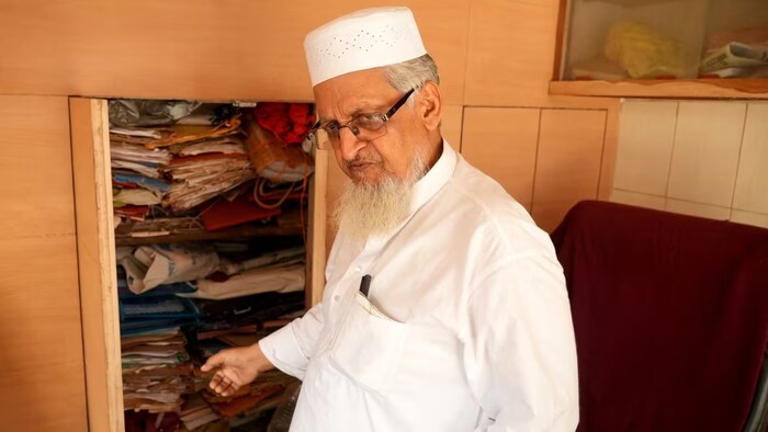 Syed Mohammad Yaseen, 78, an advocate for Gyanvapi mosque and joint secretary of Varanasi's local mosque management committee, shows a cabinet containing legal documents that he claims are related to protecting the mosque. 