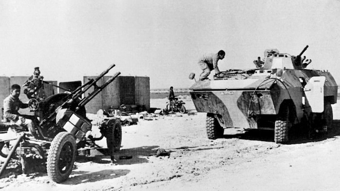 A fighter gets on a tank and another on an anti -aircraft defense battery.