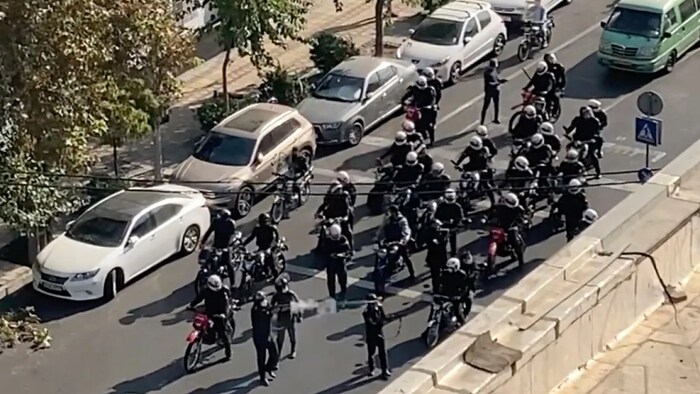 This frame grab from video taken by an individual not employed by The Associated Press and obtained by the AP outside Iran shows Iranian police arriving to disperse a protest to mark 40 days since the death in custody of 22-year-old Mahsa Amini in Tehran on Oct. 26. (The Associated Press)