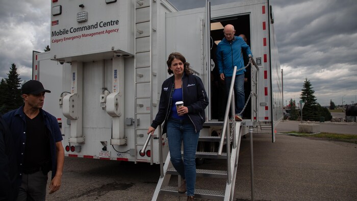 Premier Daniel Smith leaves the fire command center following Jasper Mayor Richard Ireland, Friday, July 26, 2024, in Hinton, Alta.