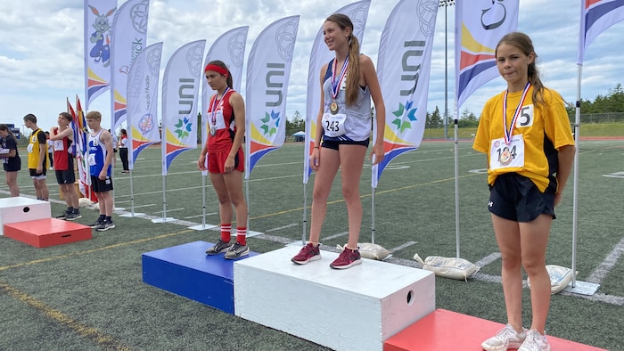 Young people mounted on podiums. acadia games, model french -speaking acadia games, model french -speaking new