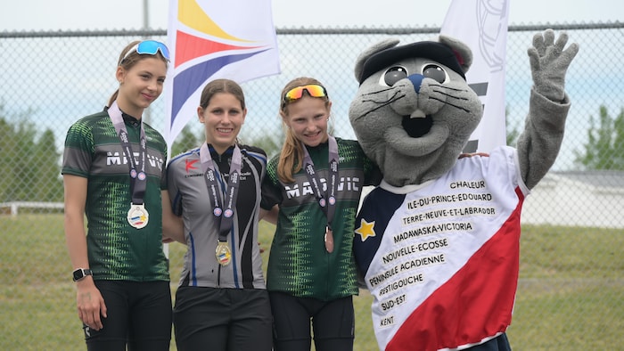 From left to right, Maé Le Gal, Annabelle Lévesque, Emma Bérubé and mahogany. acadia games, model french -speaking acadia games, model french -speaking new