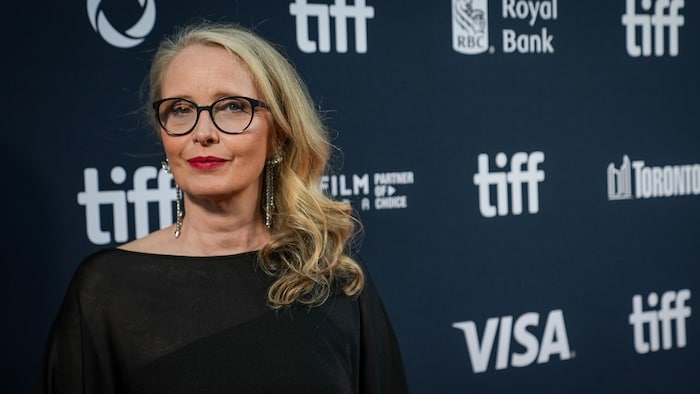 Julie Delpy poses for a photo on a red carpet.