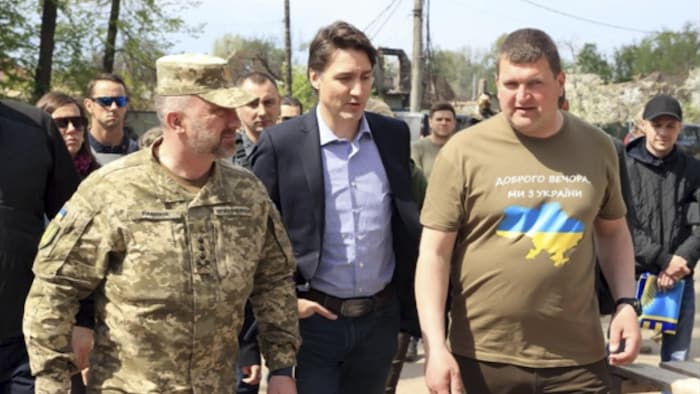 Trudeau walks with Markushyn, right, Irpin's mayor, on Sunday.