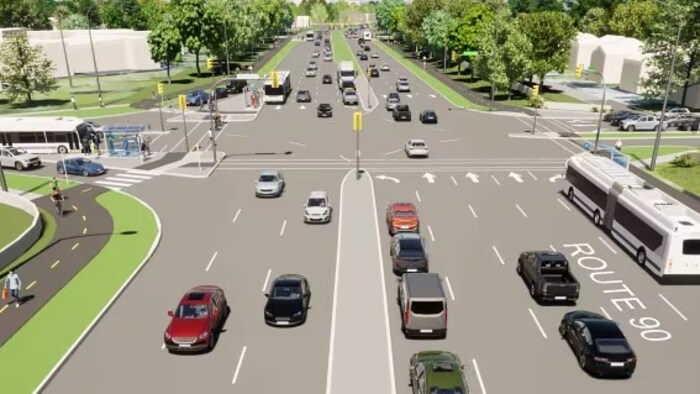 Une image de synthèse montre des voitures et des autobus à une intersection d’une route de trois voies dans chaque direction.