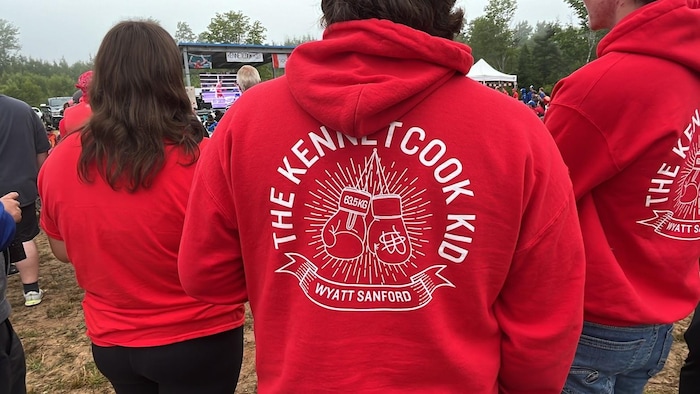 Supporters wearing custom sweaters to cheer on boxer ⁣Wyatt Sanford.