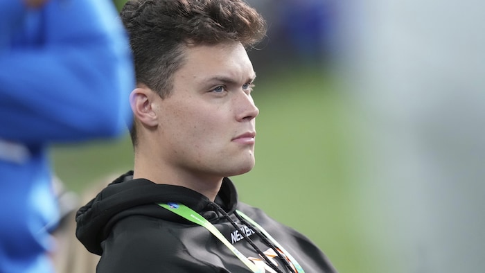 kurtis Rourke seated on the edge of the field.