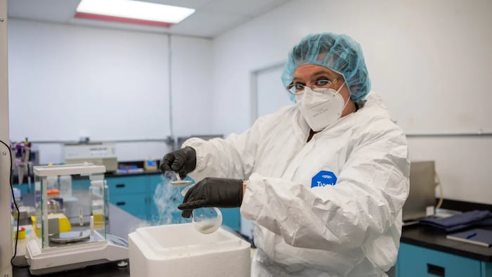 Lab workers extract psilocybin at Numinus Lab in British Columbia. It's one of a handful of facilities with a Health Canada license to do so.