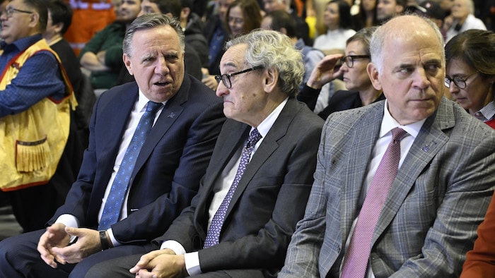François Ladult, Michael Sabia and Pierre Fitzgibbon are sitting on the side.