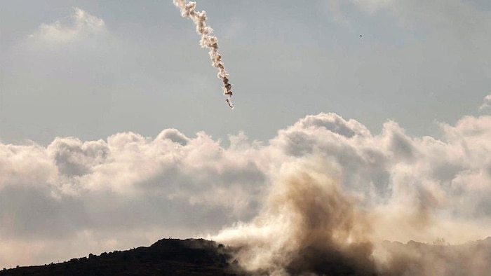 A flare fired by the Israeli army with a plume of smoke.