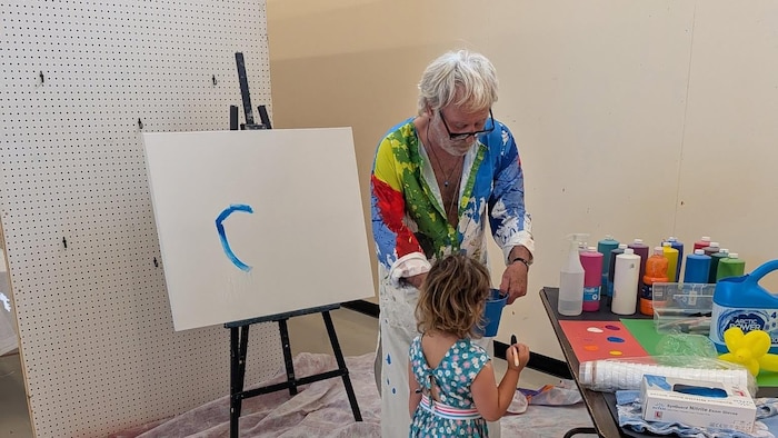 Marc Alain Marticotte et un enfant.