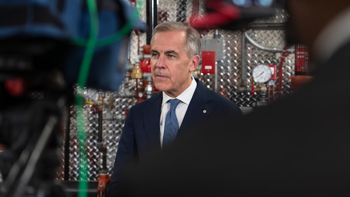 Mark Carney en conférence de presse. 