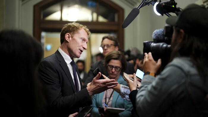 Immigration, Refugees and Citizenship Minister Mark Miller arrives for a caucus meeting on Parliament Hill in Ottawa, Wednesday, Oct. 4, 2023.