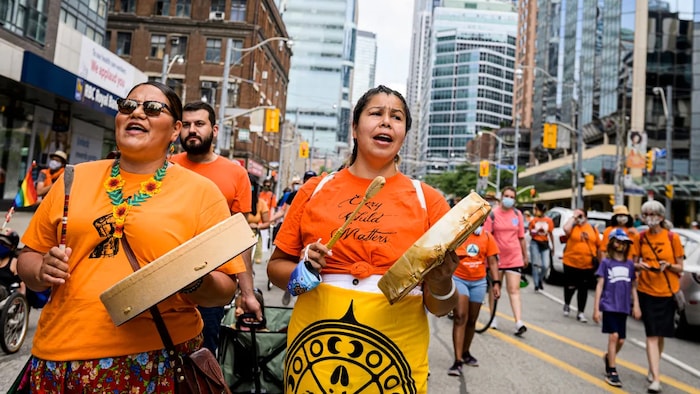 People participate in the Marche Every Child Matters, the Day of Canada Day in downtown Toronto. did donald trump relaunched canada