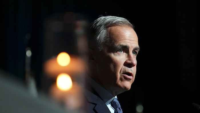 A candle lit near Mr. Carney.