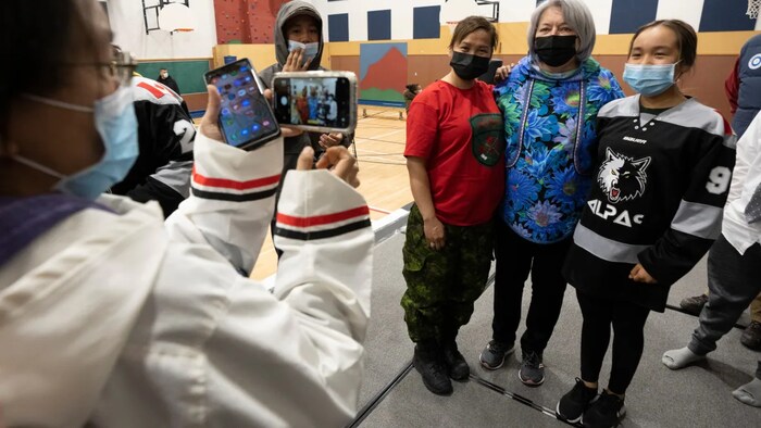 Children react during musical performances at a community gathering with Gov. Gen. Mary Simon in Kangiqsualujjuaq, Que. (Adrian Wyld/The Canadian Press)
