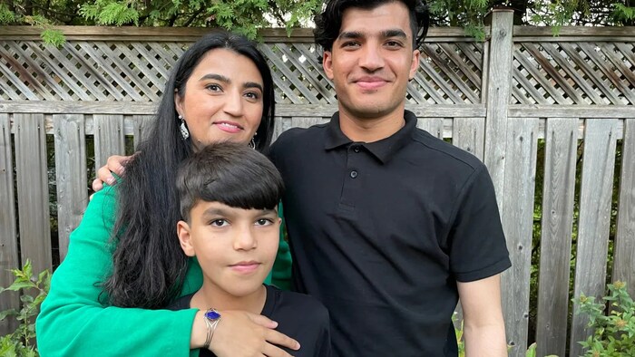 Sahar's brothers Omer Farooq Sahar (right) and Ibrahim Khalil Sahar (centre) left Afghanistan on one of the final Canadian Forces evacuation flights.