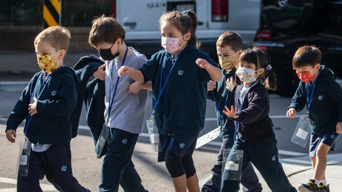 Students wear masks on school grounds in Vancouver on Friday, October 1, 2021.