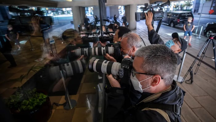 News photographers greet Huawei chief financial officer Meng Wanzhou as she arrives at court in September 2020. Her extradition case has garnered worldwide attention.
