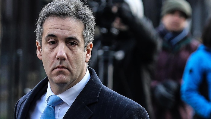 Michael Cohen looks down