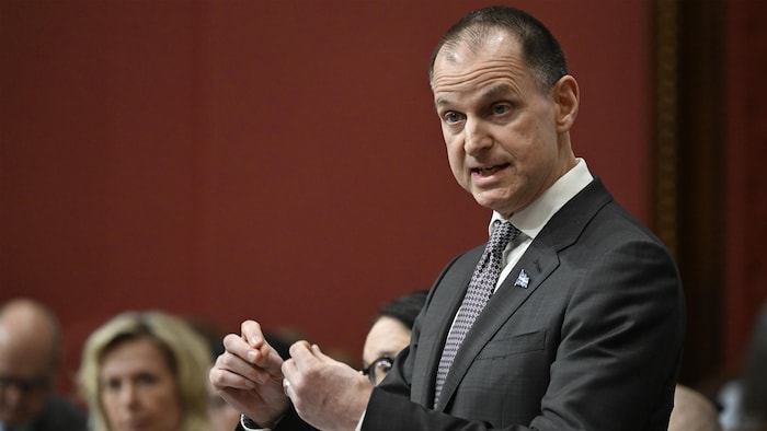 Eric Girard speaks standing in bedroom. reform school tax "precipitated return