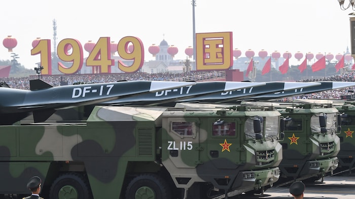 Chinese military vehicles carrying DF-17 missiles roll during a parade to commemorate the 70th anniversary of the founding of Communist China in Beijing on Tuesday, Oct. 1, 2019.