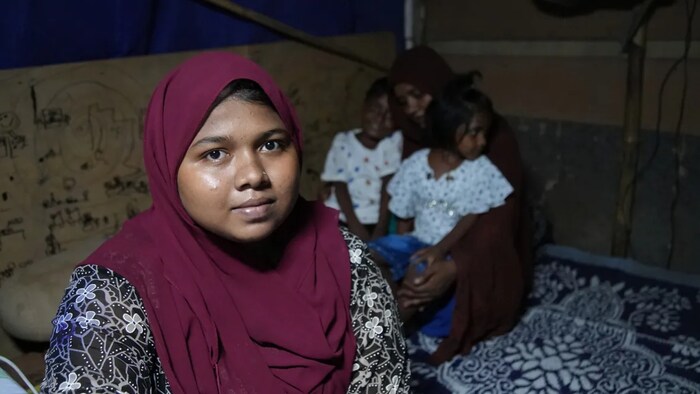 Mizan, 20, shares a narrow makeshift tent in the Delhi camp with her parents and two younger siblings. It pains her that, without citizenship documents, she can't finish her schooling and fulfill her childhood dream of becoming a doctor. (Salimah Shivji/CBC)
