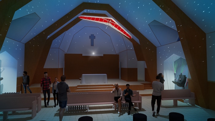 Maquette de l'intérieur de l'église avec un ciel étoilé et un deltaplane au plafond. des visiteurs marchent dans l'église.