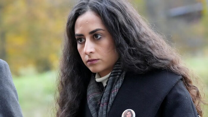 Lina Abu Akleh, niece of fatally shot Al Jazeera journalist Shireen Abu Akleh, is shown outside the International Criminal Court in The Hague, Netherlands, on Tuesday after Al Jazeera presented a letter requesting a formal investigation into the killing. (Peter Dejong/The Associated Press)