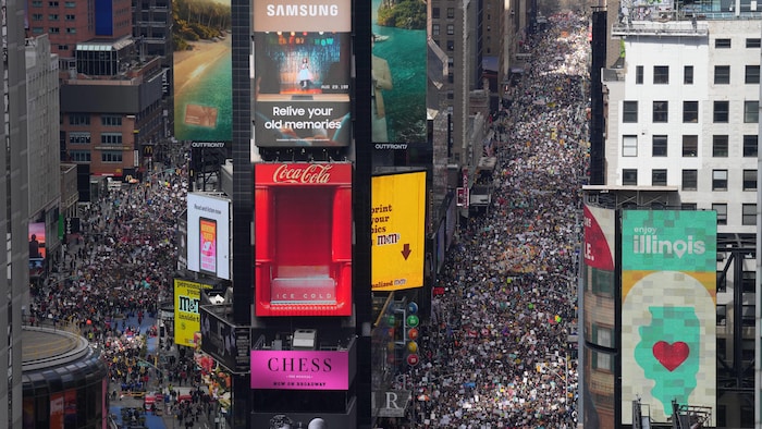People attend a "No Kings" protest Saturday, March 28, 2026, in New York. (AP Photo/Adam Gray)