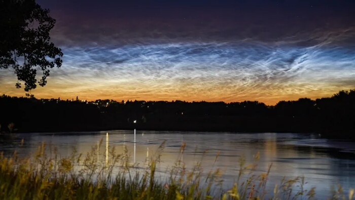 This image shows the beauty of noctilucent clouds over Medicine Hat, Alta., in 2021. This is the best time of year to catch these electric-blue clouds, which appear after sunset and before sunrise. (Submitted by Jackie Armstrong)