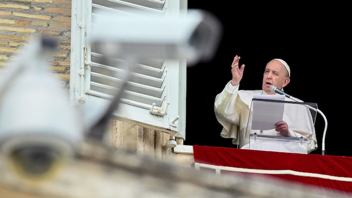 The pope speaks from his window.