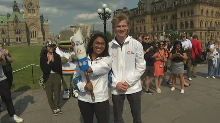 People in front of Parliament in Ottawa. canada 2025's flame summer games canada 2025's flame summer games new