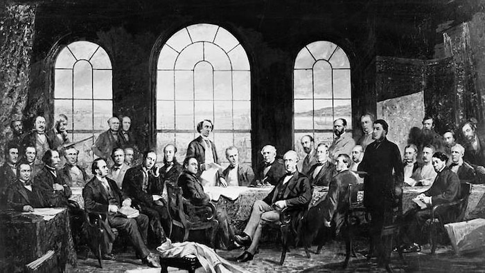 Photograph of a painting showing the Fathers of Confederation, mostly seated, in a living room.