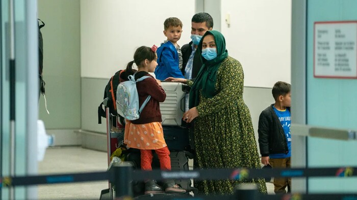 photo shows passengers inside Toronto's Pearson International Airport Feb. 23, 2021.