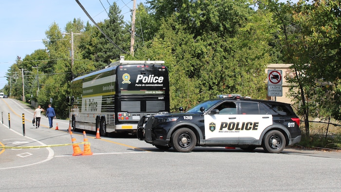 A Car And A Bus From The Sûreté Du Québec.