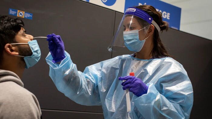A doctor administers a COVID-19 test at North York General Hospital in May 2020. Case levels are about to drop off a cliff because the majority of Canadians aren't being tested for COVID-19 due capacity issues.