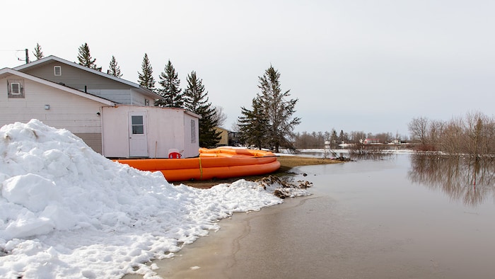 A Tiger Dam barrier protects a home threatened by flooding on Peguis First Nation. Chief Glenn Hudson says this year's flooding may be the worst the community has ever seen.