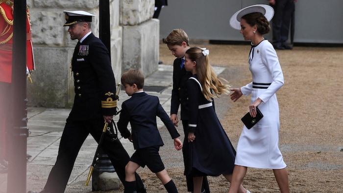 Dressed in a long white coat and hat, the Princess of Wales appeared smiling with her three children, George, Charlotte and Louis.