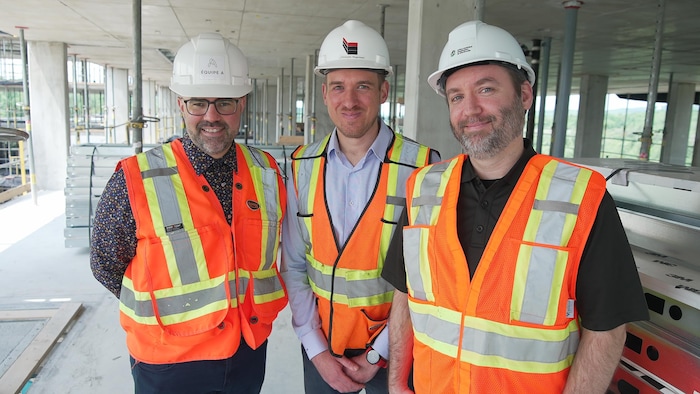Three people on a site.