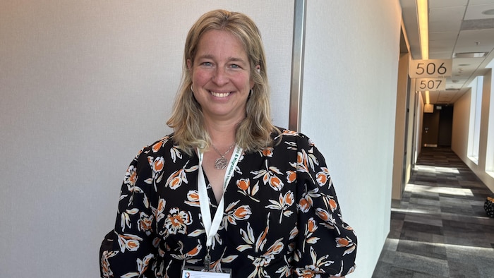A smiling family doctor at the Halifax congress center.