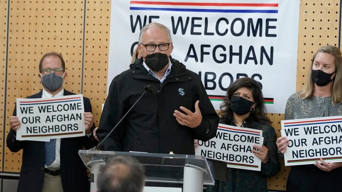 Washington Gov. Jay Inslee speaks during a news conference at the Afghan Welcome Center at the Seattle-Tacoma International Airport on Oct. 22. Veterans' groups and others have scrambled to get Afghan allies on flights out of Kabul since the capital fell to the Taliban.