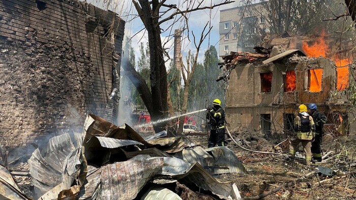 Firefighters hose down a Policlinic following a Russian attack in Dnipro, Ukraine.