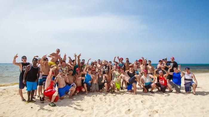 Students pose on the beach during an S-Trip in Mexico in 2016. (Submitted by Henry Grover)