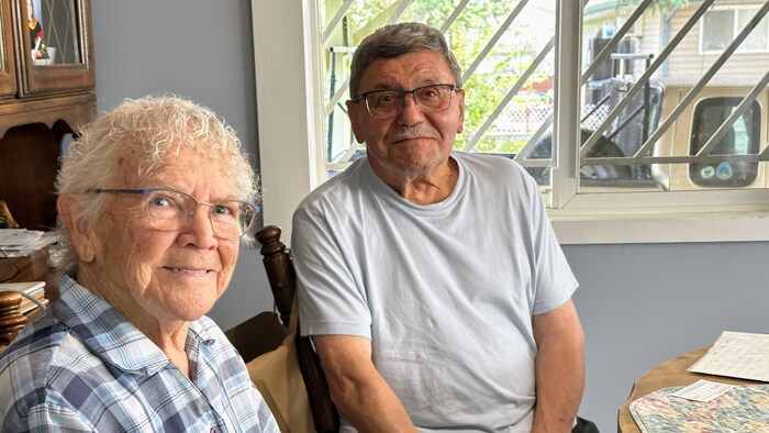 Darlene and Paul Komonoski hand in hand.