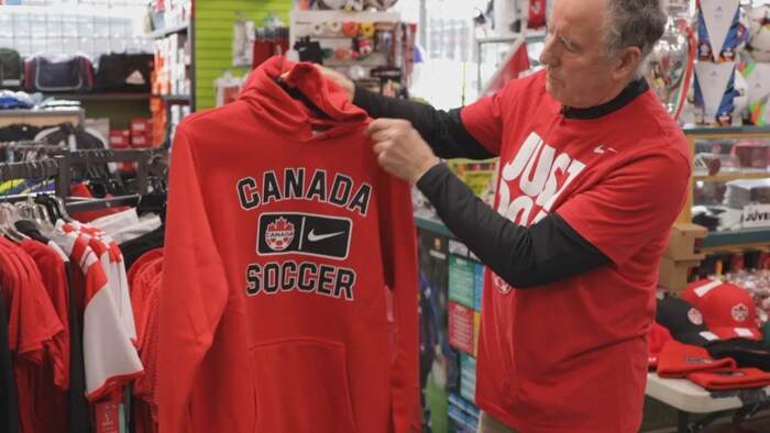 Serruccio Susin, the owner of North American Sports the Soccer Shop in Vancouver, is pictured Nov. 21, 2022. He says Canada jerseys are flying off the shelves. (Gian-Paolo Mendoza/CBC)