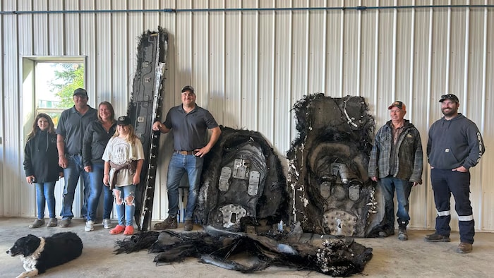 Farmers from the Ituna area, with space debris.